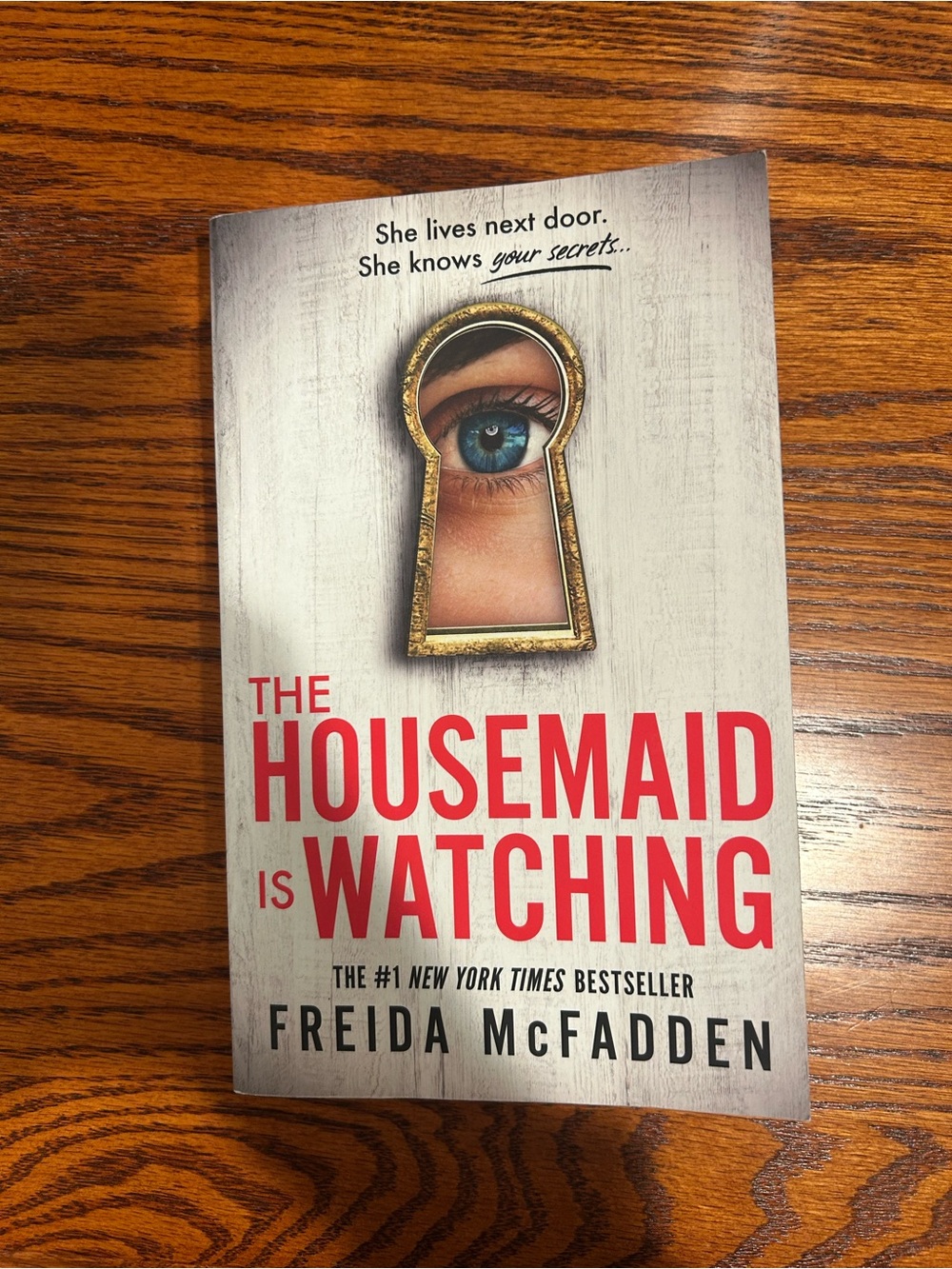 The Housemaid Is Watching by Freida McFadden - White & Red Paperback